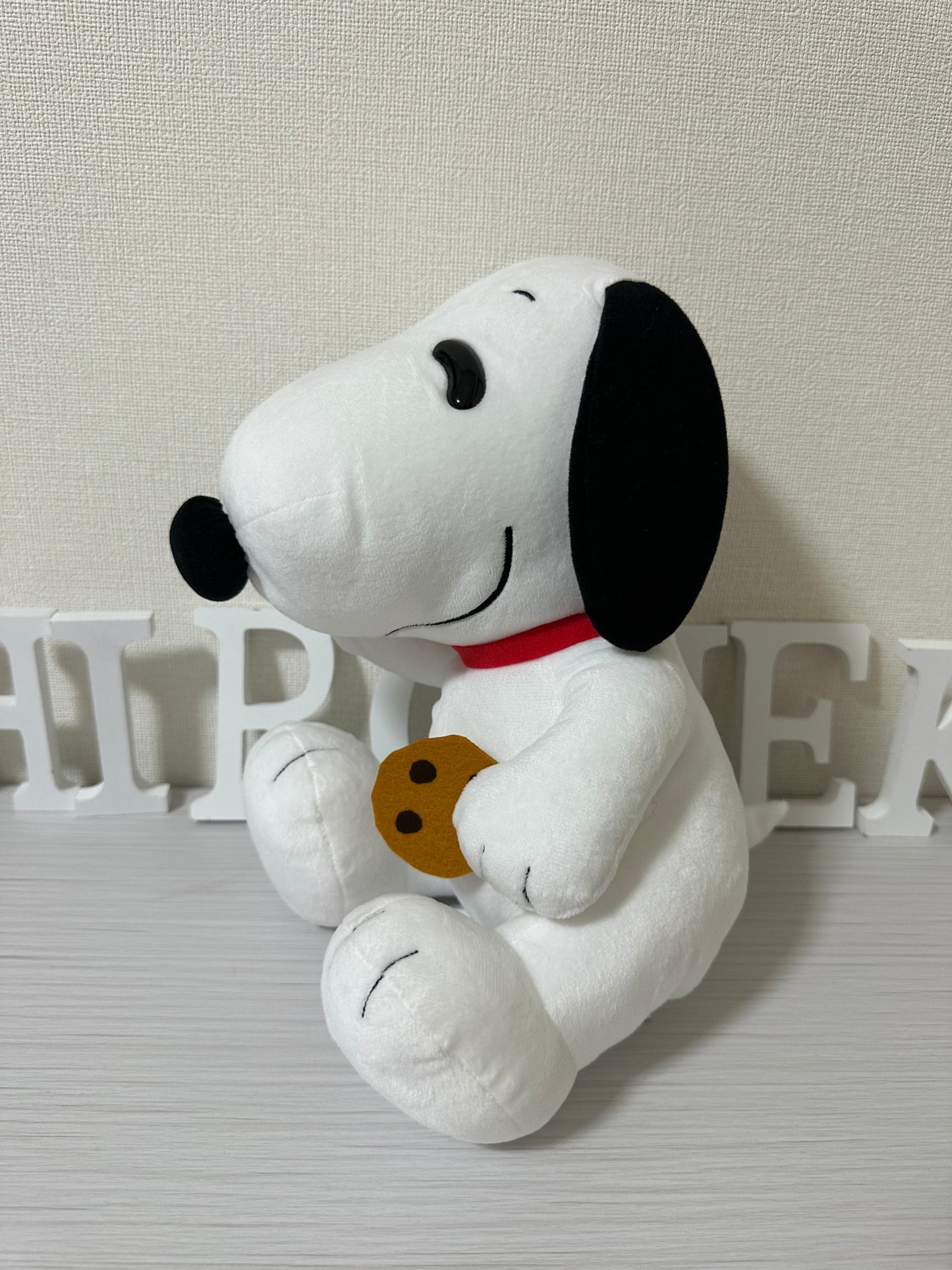 Peanuts Snoopy con galleta peluche